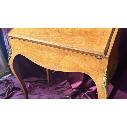 503 - A 19th century Louis XV style bureau with leather inlay, upper gilt surround and floral detailing to... 