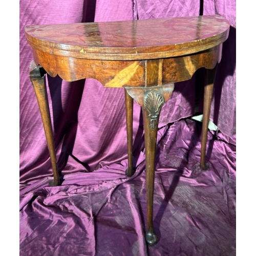 507 - Early 19th century walnut metamorphic games table in semi-circular form, with shell motif's on three... 