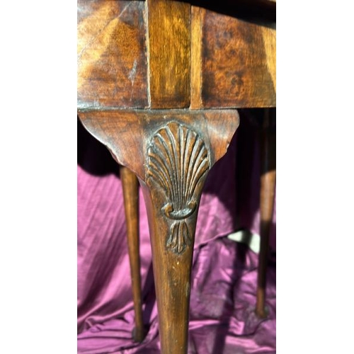 507 - Early 19th century walnut metamorphic games table in semi-circular form, with shell motif's on three... 