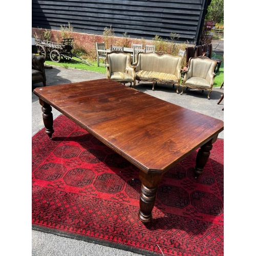 518 - A Circa 1900 Gilbert and Co. Swindon walnut extended dining table, heavy fluted legs and original ca... 