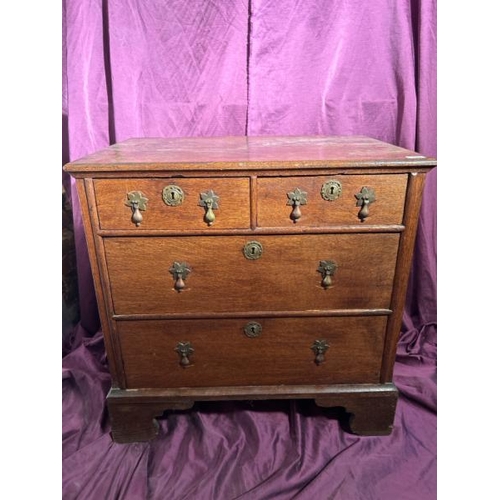 542 - An 18th century bachelorette's chest of drawers in oak with original brass fixtures, 79cm (h) x 80cm... 