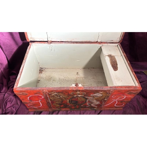 557 - A 19th century oak metal banded trunk with GR sypher and hand painted coat of arms applied in old re... 