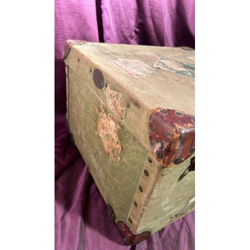 564 - An early 20th century canvas bound and riveted luggage trunk, 31cm (h) x 50.5cm (w) x 45.5cm (d)  / ... 