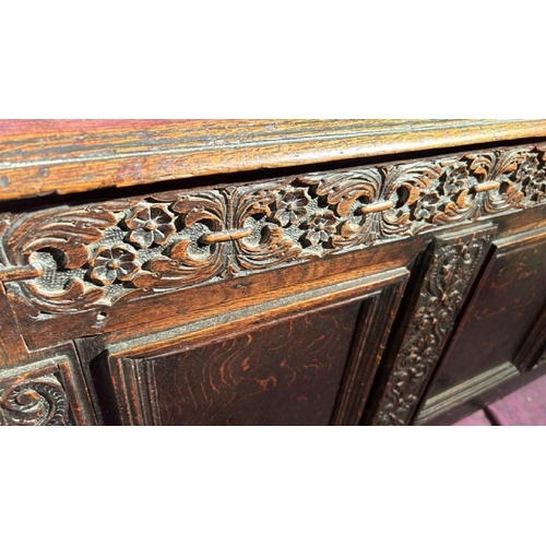 569 - A 19th century finely carved oak coffer, 60cm (h) x 138cm (w) x 55cm (d)  / All lots are located at ... 