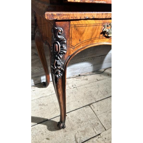 571 - An 18th century Queen Anne walnut escritoire on associated base, profusely carved and inlaid through... 