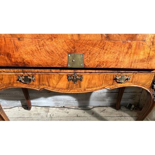 571 - An 18th century Queen Anne walnut escritoire on associated base, profusely carved and inlaid through... 