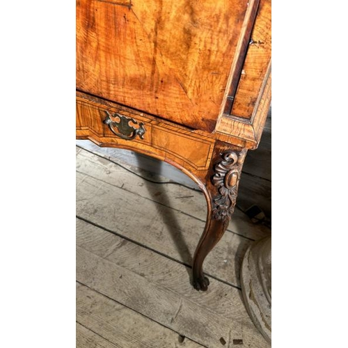 571 - An 18th century Queen Anne walnut escritoire on associated base, profusely carved and inlaid through... 