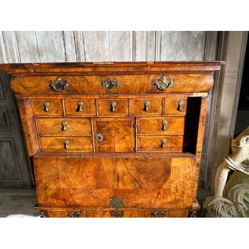 571 - An 18th century Queen Anne walnut escritoire on associated base, profusely carved and inlaid through... 