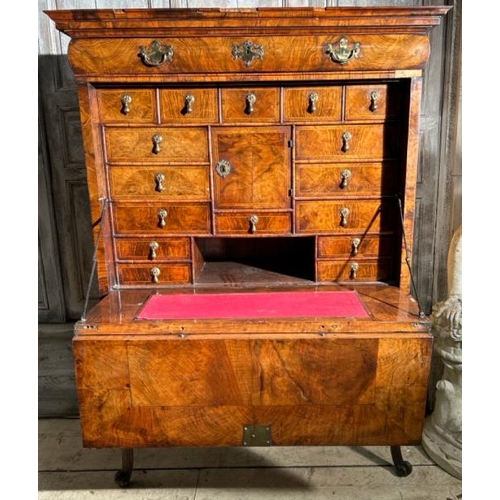 571 - An 18th century Queen Anne walnut escritoire on associated base, profusely carved and inlaid through... 