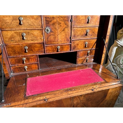 571 - An 18th century Queen Anne walnut escritoire on associated base, profusely carved and inlaid through... 