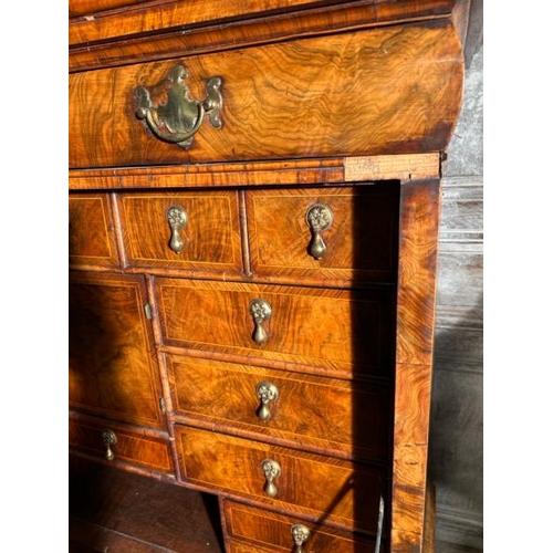 571 - An 18th century Queen Anne walnut escritoire on associated base, profusely carved and inlaid through... 