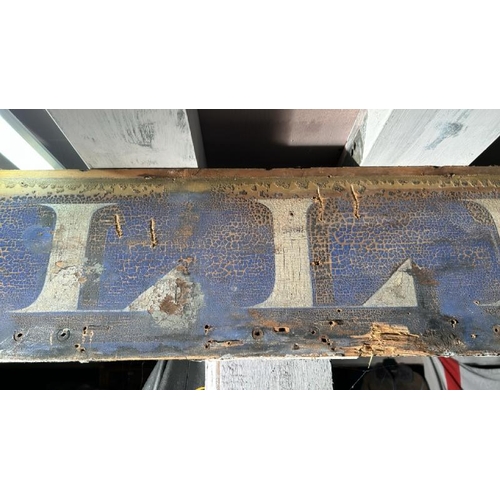 573 - A painted wooden 'Tiller' sign, 200cm (w) x 27cm (h)  / All lots are located at The Barn, Hampstead ... 