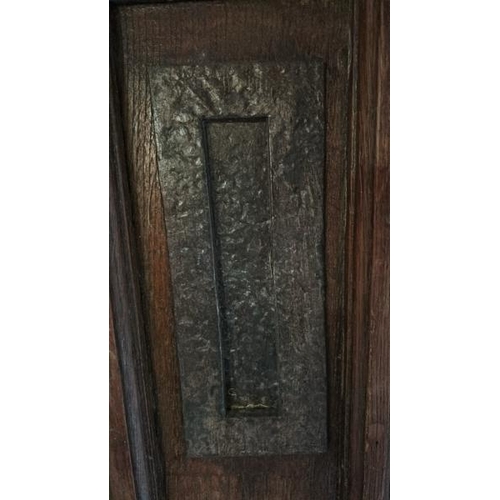 576 - A large 1920's gothic style front entry door with original cast iron features and glazed window, com... 