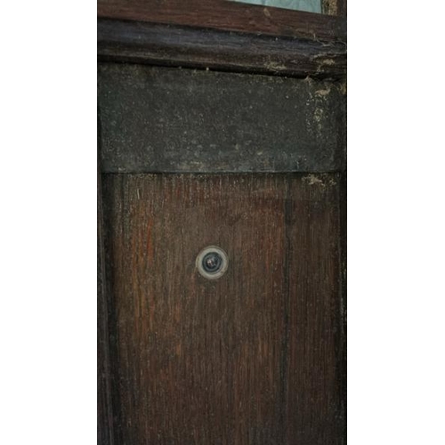 576 - A large 1920's gothic style front entry door with original cast iron features and glazed window, com... 