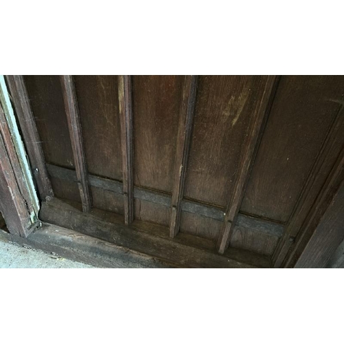 576 - A large 1920's gothic style front entry door with original cast iron features and glazed window, com... 