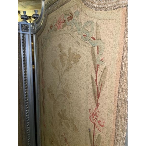 579 - A 19th century Louis XVI four panel screen with silvered paint finish and original needlework panels... 