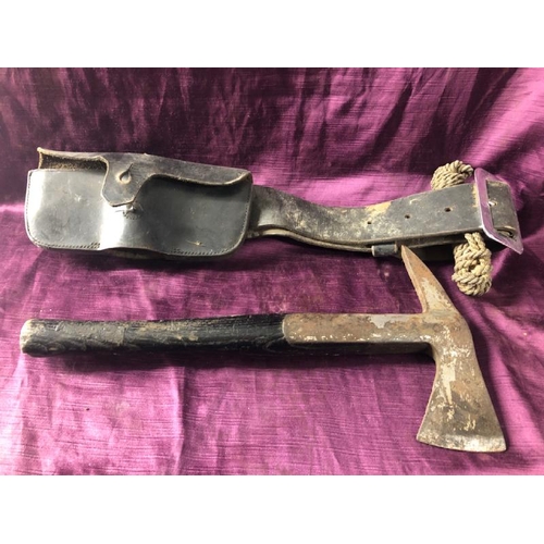 63 - Early 20th century firemans axe with pouch, 38.5cm (l) x 20cm (w)  / All lots are located at The Bar... 