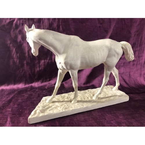 72 - Plaster mouldingof a horse, damaged base, 26cm (h) x 40cm (l)  / All lots are located at The Barn, H... 