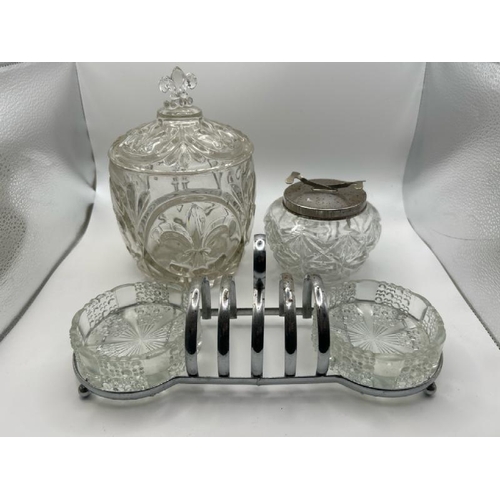 107 - Two cut class jars and a toast rack server, largest jar 20cm (h), server 26cm (l)  / All lots are lo... 