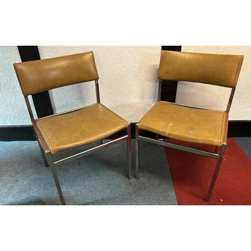 12 - A pair of 60's/70's style dining chairs with mustard yellow seat and back, on metal frame, 76cm (h) ... 