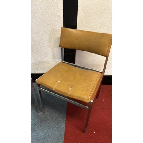 12 - A pair of 60's/70's style dining chairs with mustard yellow seat and back, on metal frame, 76cm (h) ... 