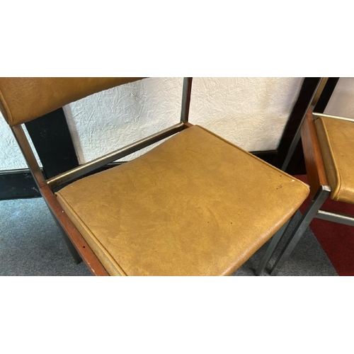 12 - A pair of 60's/70's style dining chairs with mustard yellow seat and back, on metal frame, 76cm (h) ... 