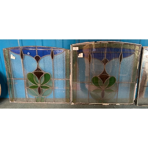 126 - A pair of matching stained glass windows, both slightly different sizes, largest 80cm (h) x 80cm (w)... 