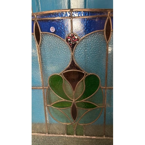 126 - A pair of matching stained glass windows, both slightly different sizes, largest 80cm (h) x 80cm (w)... 