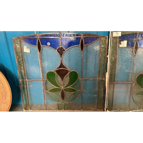 126 - A pair of matching stained glass windows, both slightly different sizes, largest 80cm (h) x 80cm (w)... 