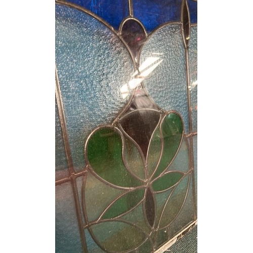 126 - A pair of matching stained glass windows, both slightly different sizes, largest 80cm (h) x 80cm (w)... 