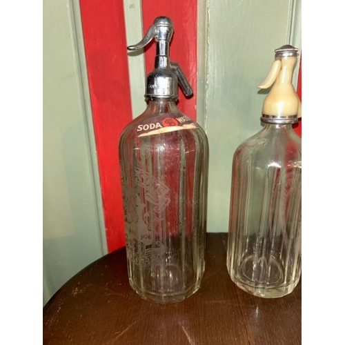 168 - Five vintage soda syphons including Spooner & Sons, Schweppes and more  / All lots are located at Go... 