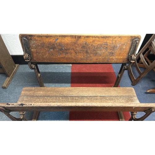 17 - A Victorian oak children's two seater school desk with folding lid on cast iron base, 58cm (h) x 98c... 