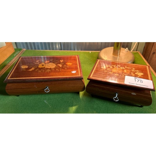 175 - Two graduated inlaid trinket jewellery boxes which both play music, one winder in need of repair, la... 