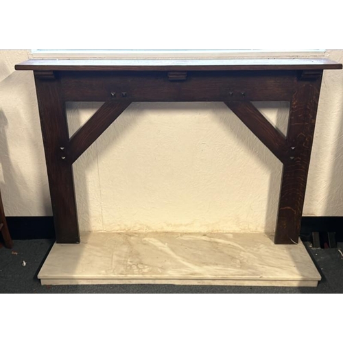 19 - An oak fire surround with a white marble base, surround 96.5cm (h) x 142.5cm (w) x 20.5cm (d), base ... 