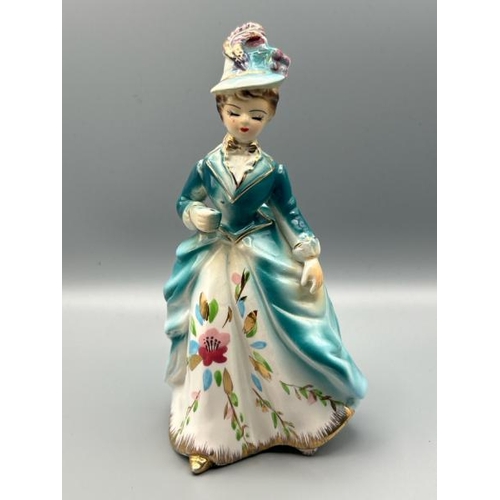 196 - Vintage porceline figurine of a lady in a blue hat, possibly missing umbrella, otherwise good condit... 