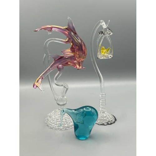 209 - Three delicate murano style glass animals including a bird in a cage, dolphins and long beak blue bi... 