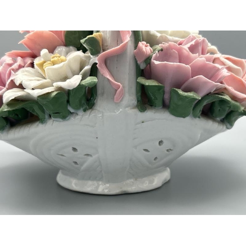 234 - Vintage porceline flower basket with some minor damage to top of handle, 19cm high  / All lots are l... 