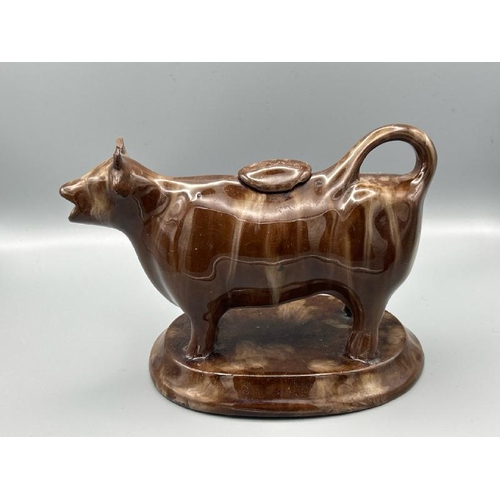 236 - Small glazed early 20th century vase and glazed pottery cow shaped gravy boat  / All lots are locate... 