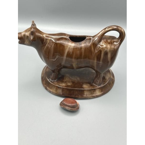 236 - Small glazed early 20th century vase and glazed pottery cow shaped gravy boat  / All lots are locate... 