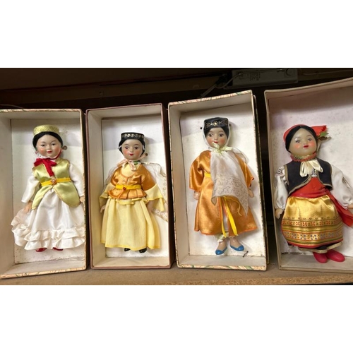 240 - Four boxed dolls all in traditional dress and in good condition  / All lots are located at Gower Rec... 