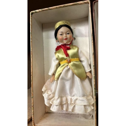 240 - Four boxed dolls all in traditional dress and in good condition  / All lots are located at Gower Rec... 