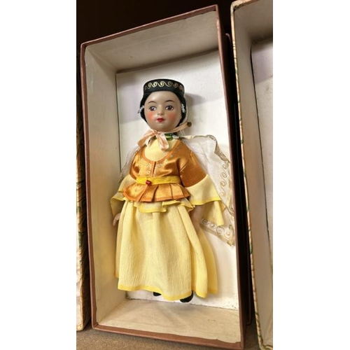 240 - Four boxed dolls all in traditional dress and in good condition  / All lots are located at Gower Rec... 