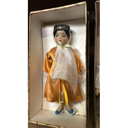 240 - Four boxed dolls all in traditional dress and in good condition  / All lots are located at Gower Rec... 