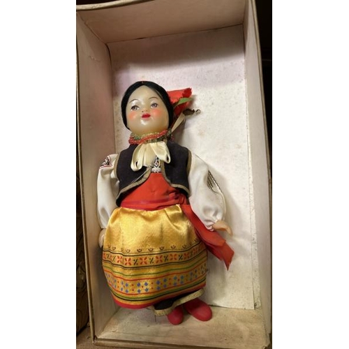 240 - Four boxed dolls all in traditional dress and in good condition  / All lots are located at Gower Rec... 