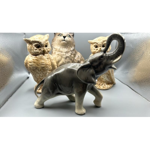 241 - Collection of porceline animals including Beswick cat dated 1967, owls and west german elephant, tal... 