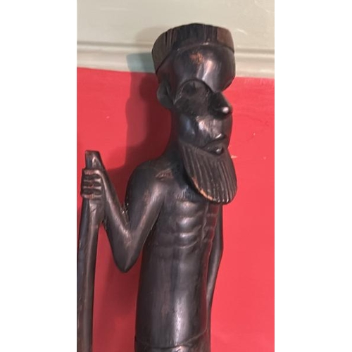 242 - Carved dark wood african elderly man, 37cm high  / All lots are located at Gower Reclamation, Unit 1... 