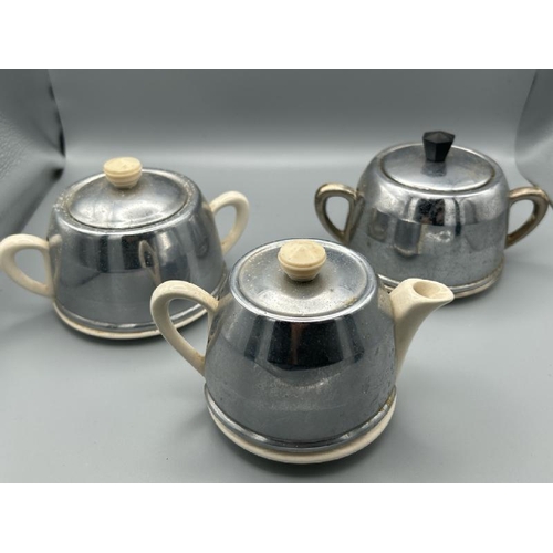 260 - A collection of Art Deco silver plate insulated tea pots, coffee pots, and sugar bowls, 9 pieces,   ... 