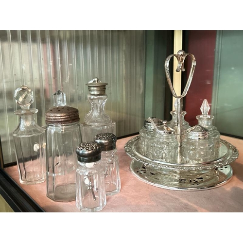 264 - A collection of cut glass and plated condiment pots and bottles  / All lots are located at Gower Rec... 