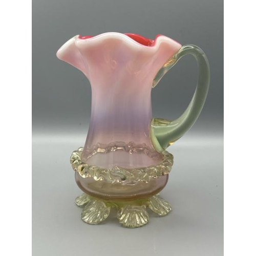 287 - Victorian cranberry red vaseline jug with frilled rim, 13cm (h)  / All lots are located at Gower Rec... 