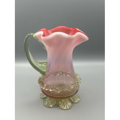 287 - Victorian cranberry red vaseline jug with frilled rim, 13cm (h)  / All lots are located at Gower Rec... 